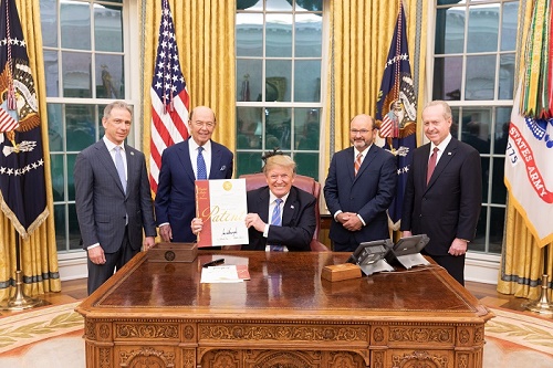 Director Iancu, Secretary Ross, President Trump, inventor Joseph Marron, and Raytheon CEO Tom Kennedy in the Oval Office.